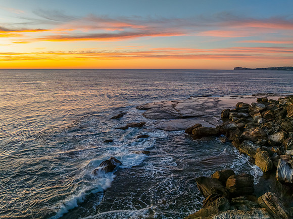 Sunrise at the seaside with high cloud