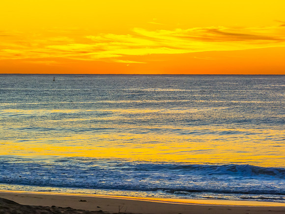 Sunrise at the seaside with high cloud