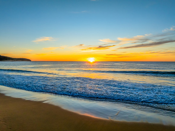 Sunrise at the seaside with high cloud