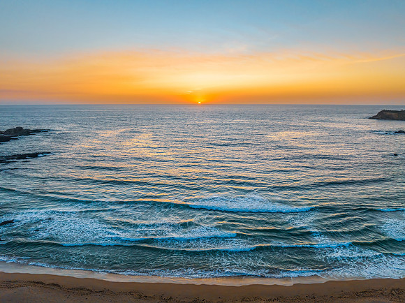 Sunrise seascape with high clouds