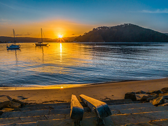 Early morning sunrise views at the waterfront where the water me