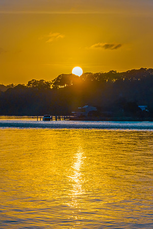 Early morning sunrise views at the waterfront where the water me