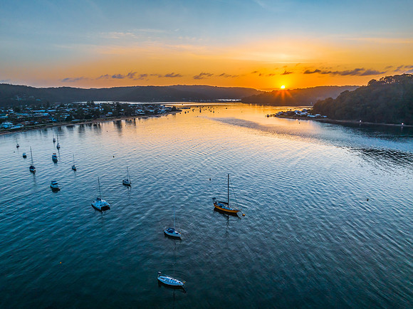 Early morning sunrise views at the waterfront where the water me