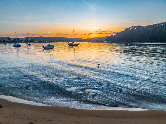 Early morning sunrise views at the waterfront where the water me