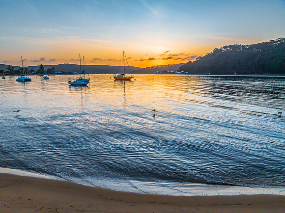 Early morning sunrise views at the waterfront where the water me