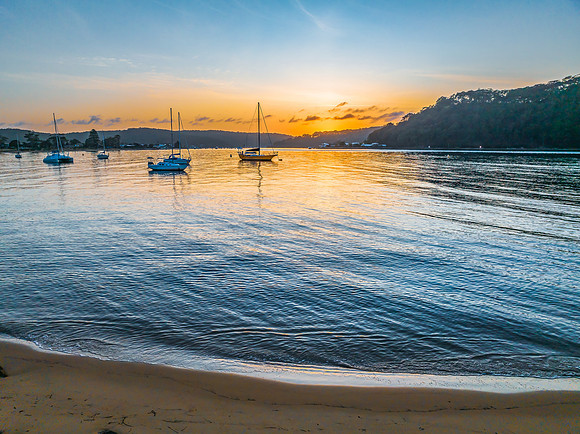 Early morning sunrise views at the waterfront where the water me