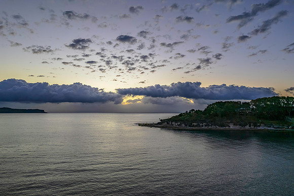 Aerial sunrise seascape with clouds