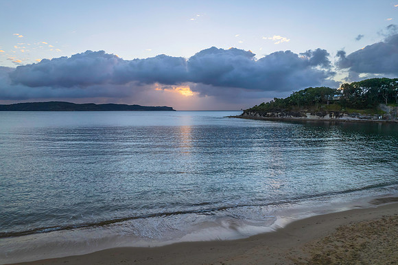 Aerial sunrise seascape with clouds