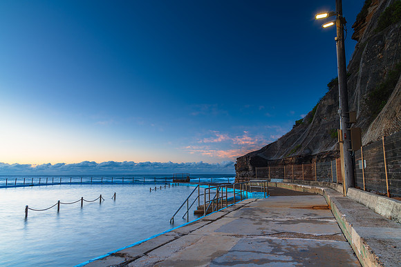 Sunrise by the sea pool