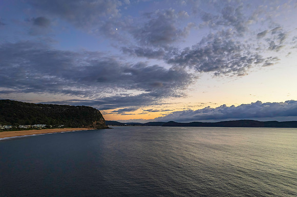 Aerial sunrise seascape with clouds