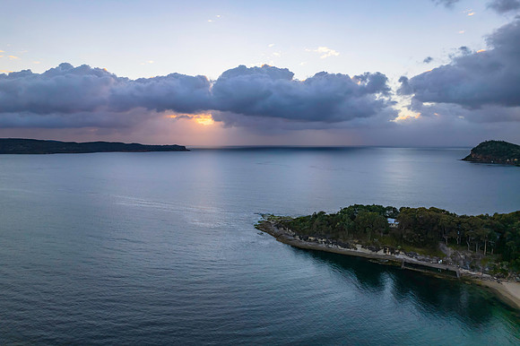 Aerial sunrise seascape with clouds