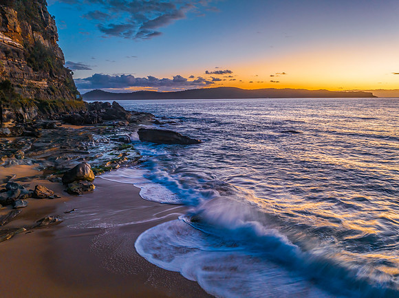 Aerial sunrise views over the ocean and beach