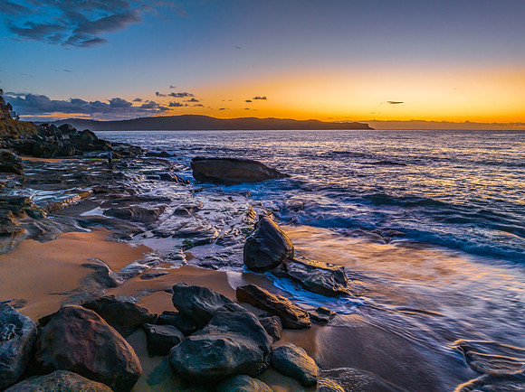Aerial sunrise views over the ocean and beach