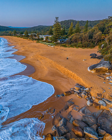 Aerial sunrise views over the ocean and beach