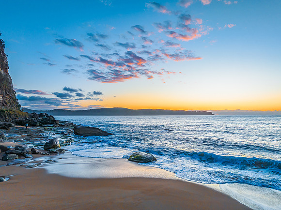 Aerial sunrise views over the ocean and beach