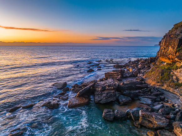 Sunrise at the seaside with orange horizon