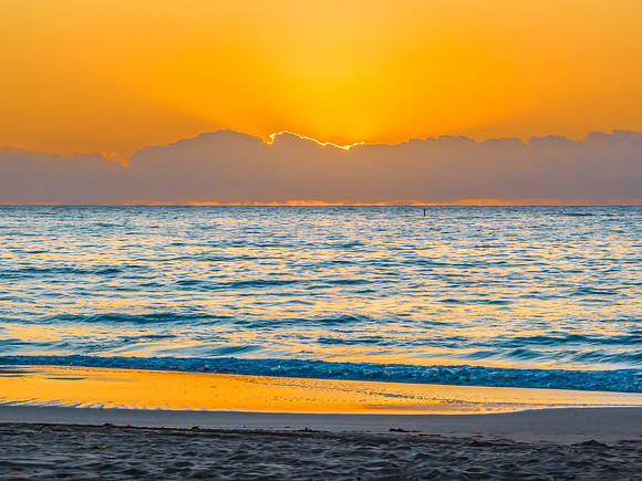 Sunrise at the seaside with orange horizon