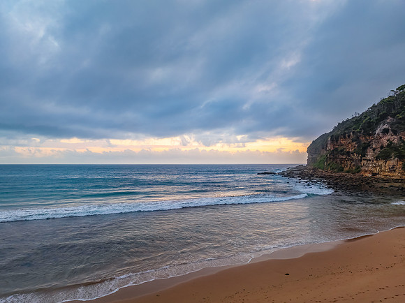 Cloud filled sunrise at the seaside