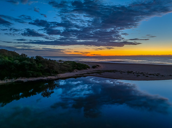 Summer sunrise at the seaside lagoon