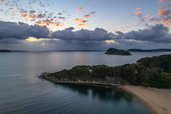 Aerial sunrise seascape with clouds