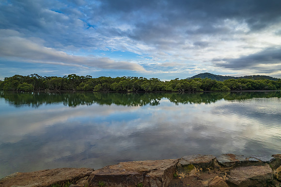 Clouds and reflections early morning waterscape