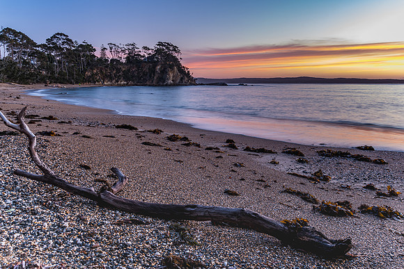 Colourful Streaky Clouds Sunrise Seascape with Driftwood