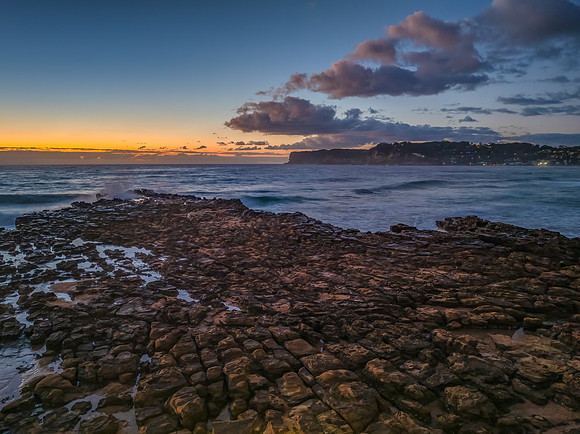 Sunrise over the sea and rock platform