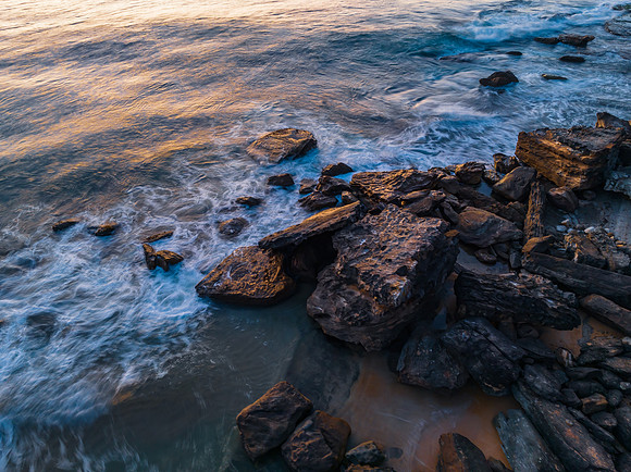 Pretty blue sunrise at the beach with calm seas