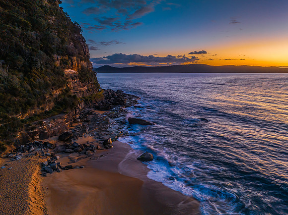 Aerial sunrise views over the ocean and beach