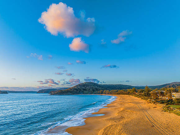 Aerial sunrise views over the ocean and beach
