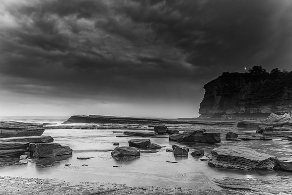 Moody Sunrise Rocky Seascape in Black and White
