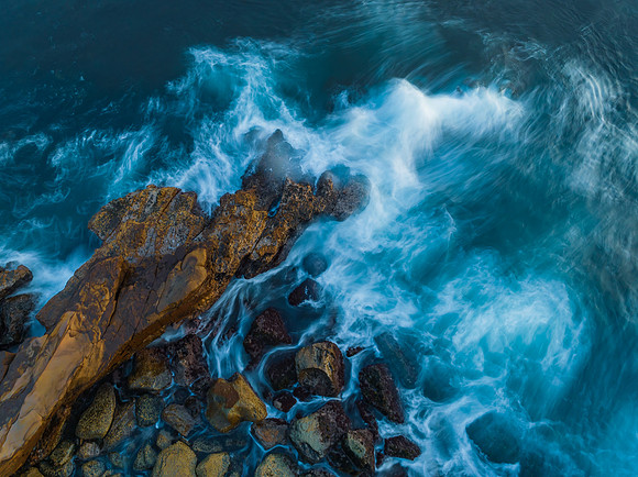 Blue hour, rocks and the sea