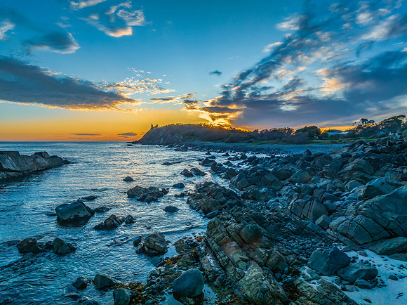 Coastal Sunrise with Rock Formations