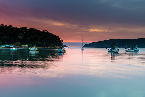 Serene Morning Waterscape with Soft Clouds over the Bay