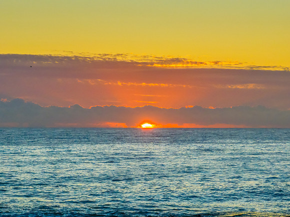 Sunrise blues over the sea and rocky Inlet