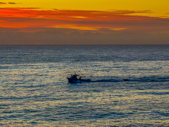 Sunrise blues over the sea and rocky Inlet