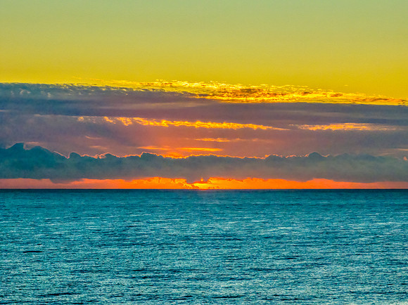 Sunrise blues over the sea and rocky Inlet