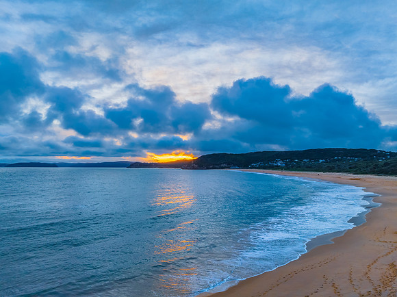 High cloud sunset over the sea and beach