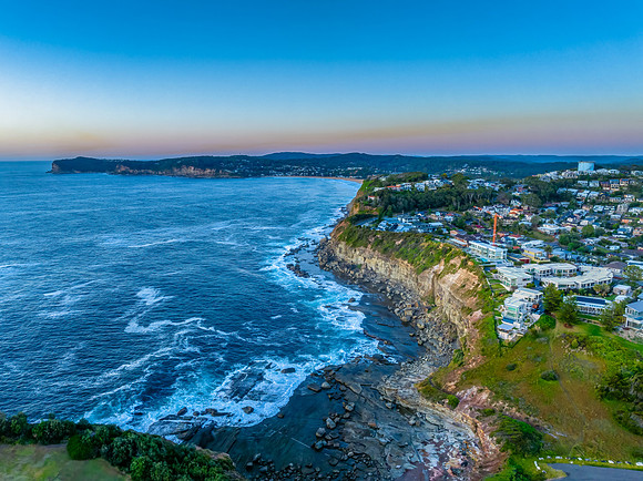 Sunrise blues over the sea and rocky Inlet