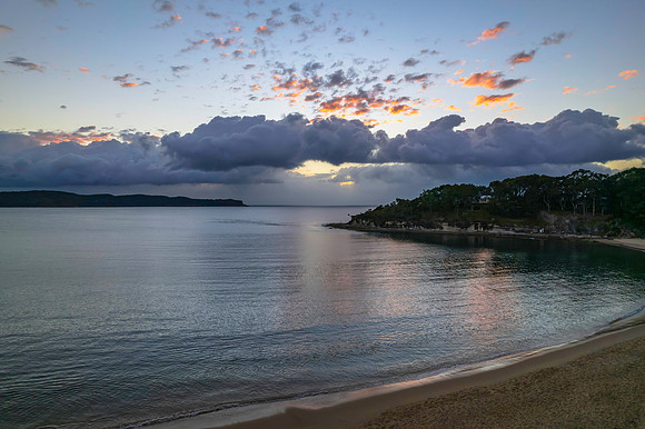 Aerial sunrise seascape with clouds