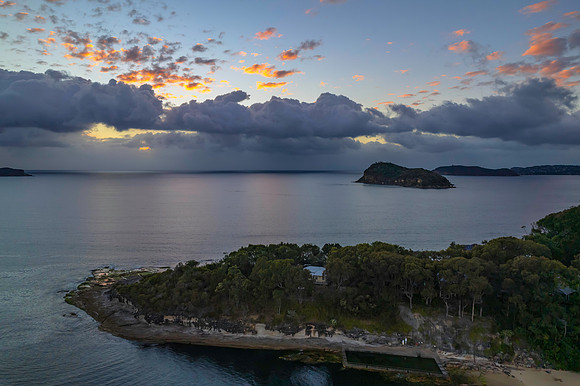 Aerial sunrise seascape with clouds