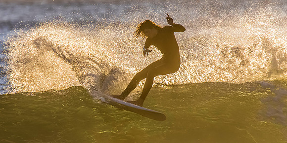 Surfers and Sunrise at the seaside