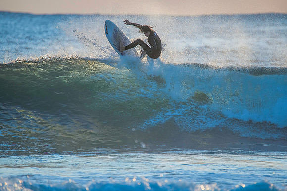 Surfers and Sunrise at the seaside