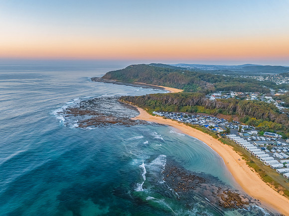 Aerial sunrise at the beach with clear skies