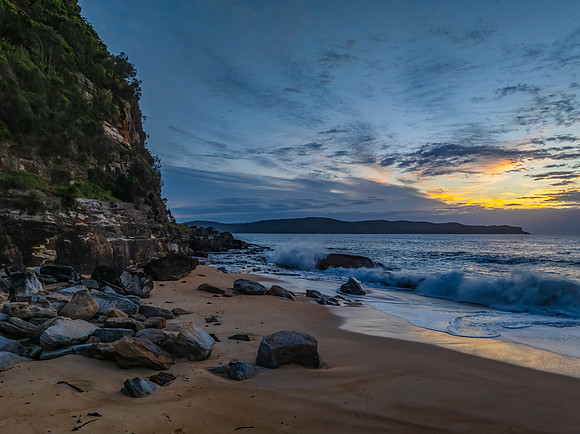 Sunrise, clouds and surf at the seaside