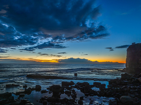 Sunrise over the ocean and rocky Inlet