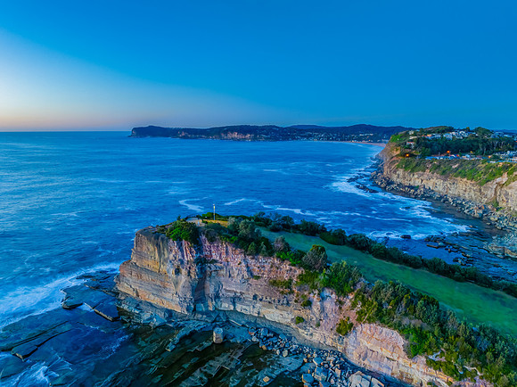 Sunrise blues over the sea and rocky Inlet