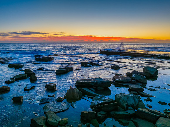 Sunrise blues over the sea and rocky Inlet