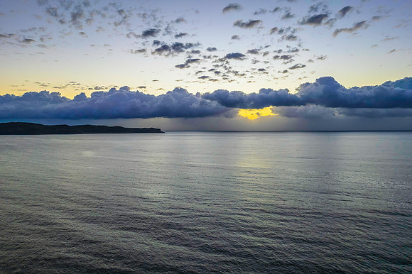 Aerial sunrise seascape with clouds