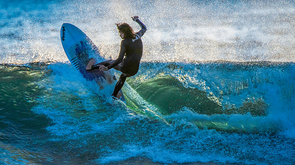 Surfers and Sunrise at the seaside